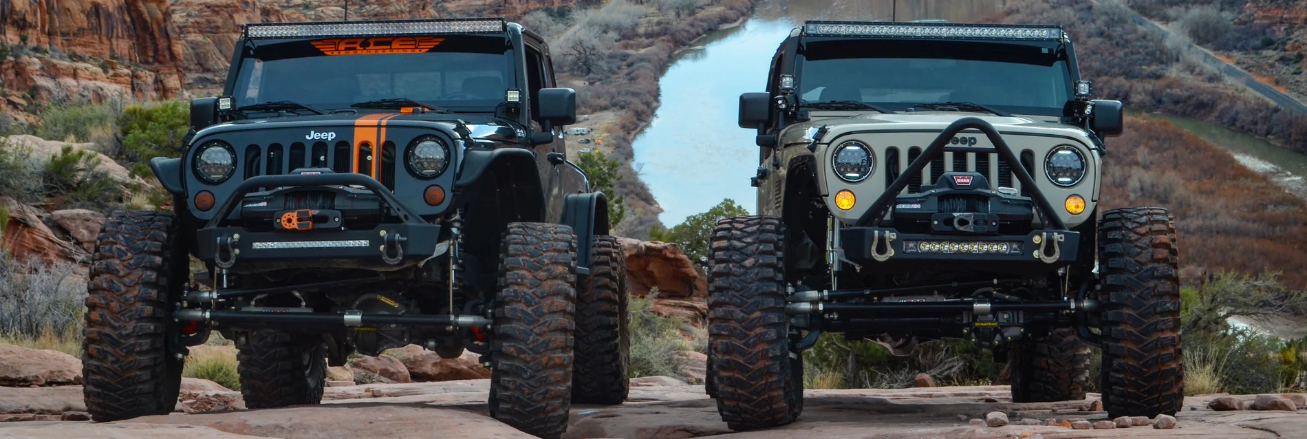 Two off-road vehicles equipped with ACE Engineering bumpers and armor